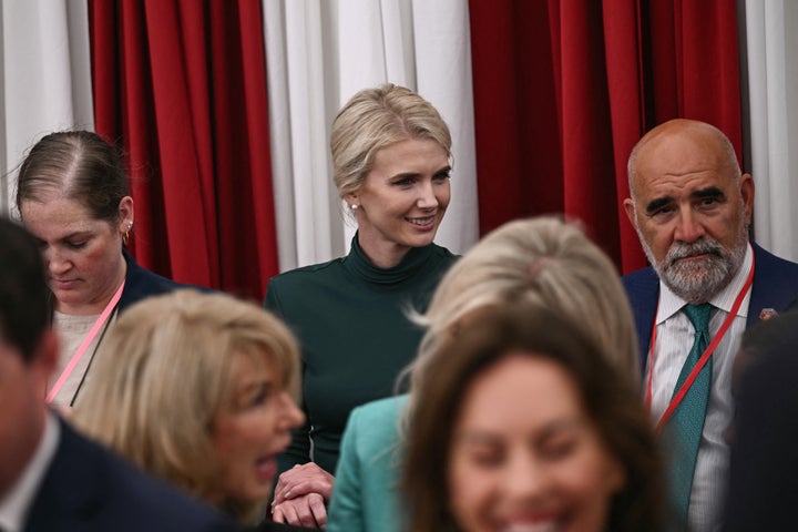 White House aide Natalie Harp (center) attends a welcome event for President Donald Trump at the U.S. ambassador's residence in Dublin on Saturday. Trump stopped in Dublin for a few hours before heading west to his Trump International Golf Links to attend the Irish Open. 