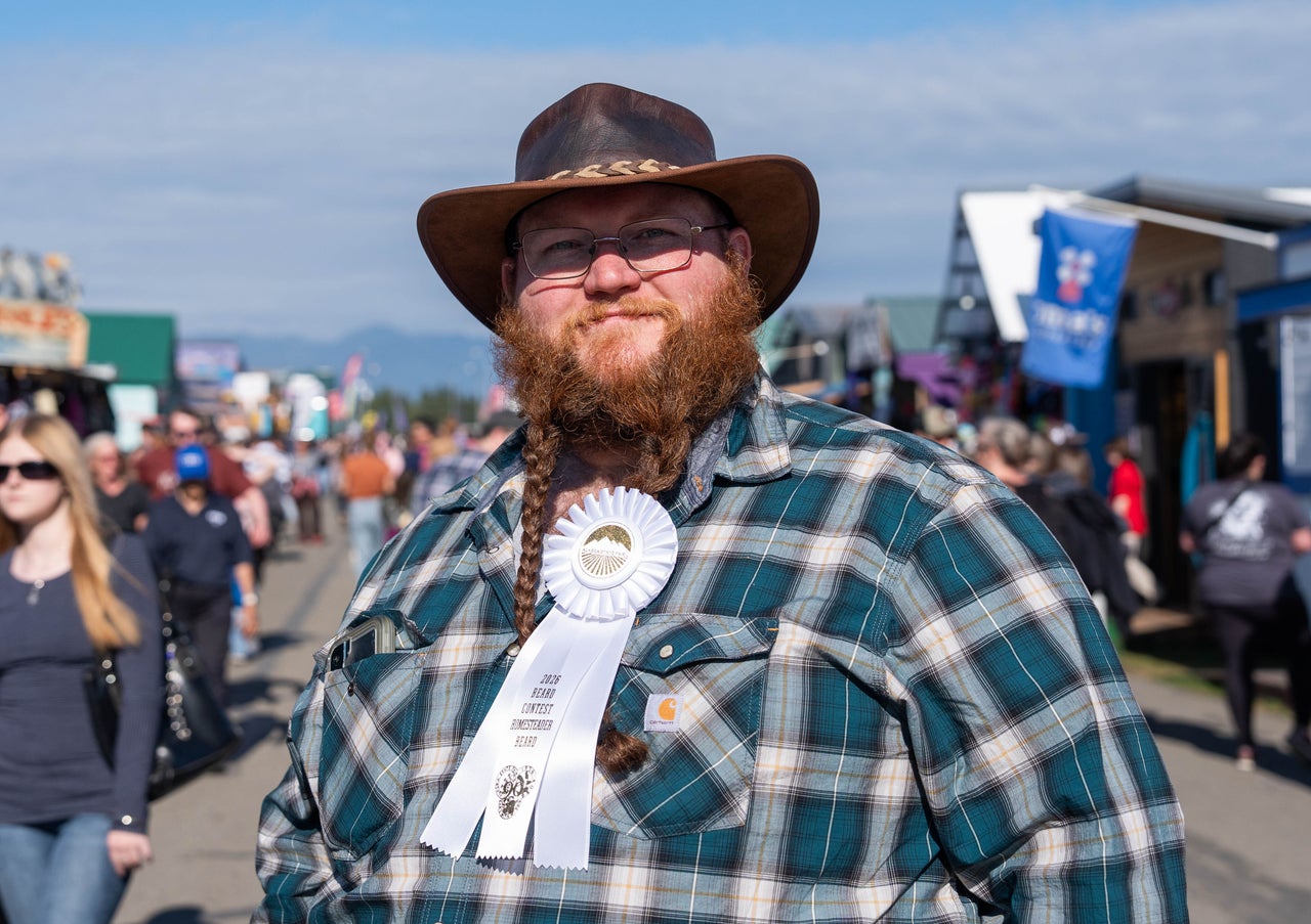 Lowell Button walks through the Alaska State Fair with a third-place ribbon that he won in the “homestead” category of the beard contest on Sept. 4, 2026, in Palmer, Alaska.