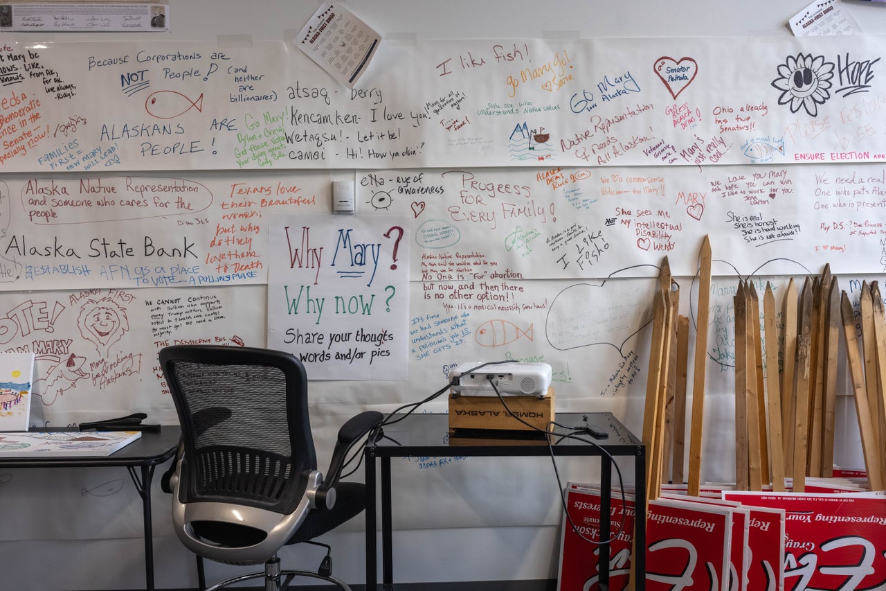 Handwritten banners supporting Mary Peltola’s Senate campaign hang in her field office in Anchorage, Alaska.