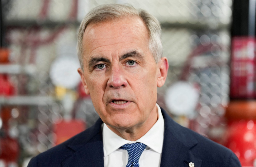 Canada's Prime Minister Mark Carney speaks as he meets unionized skilled trades workers at the United Association of Journeymen and Apprentices of the Plumbing and Pipefitting Industry of the United States and Canada (UA) office in Calgary, Alberta, Canada, May 15, 2026.