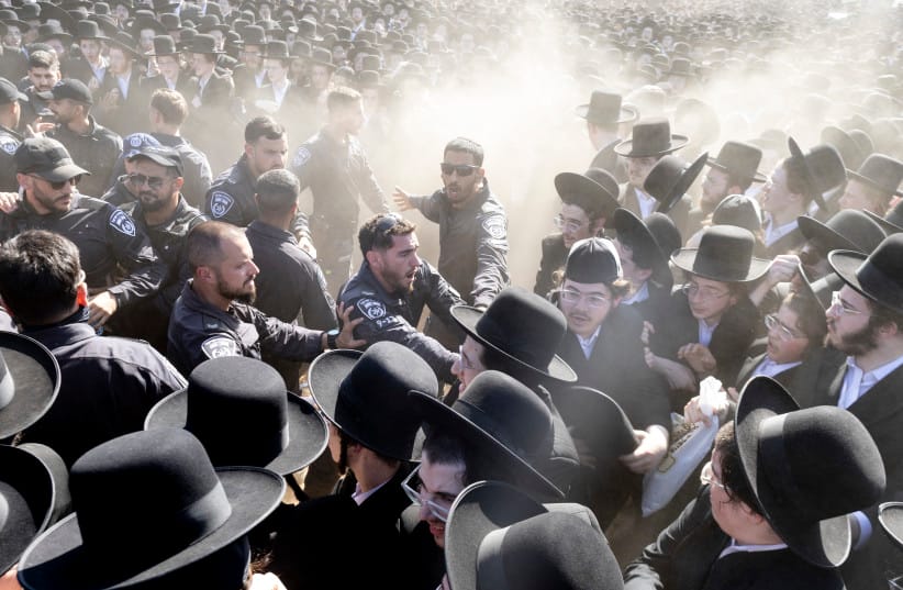 Israeli police clash with haredi protesters during a mass demonstration against military conscription outside the Beit Lid military base in June.