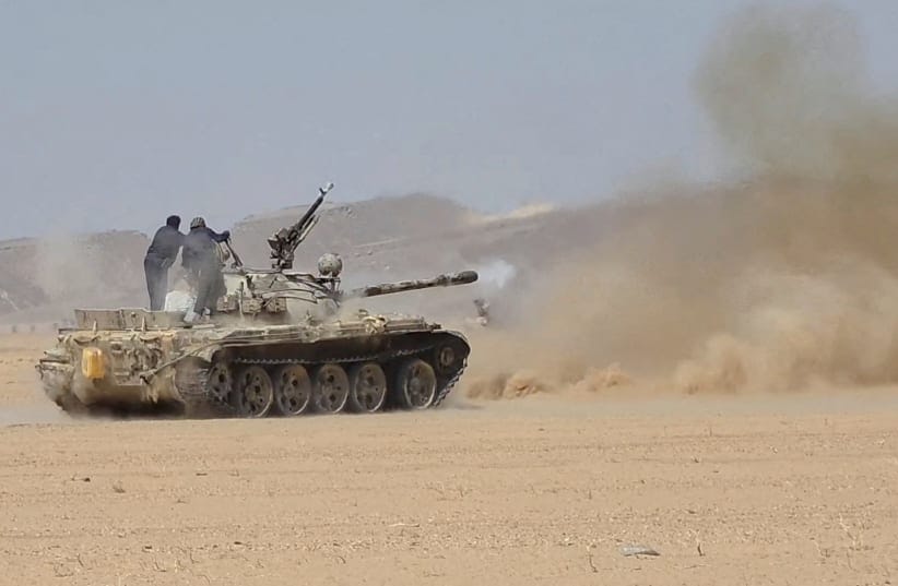 Members of the Saudi-backed Yemeni government forces fire a tank during what they say to be clashes with Yemen's Iran-aligned Houthis in a location given as near Al-Hazm, Yemen, in this screen grab obtained from a handout video released September 9, 2026.