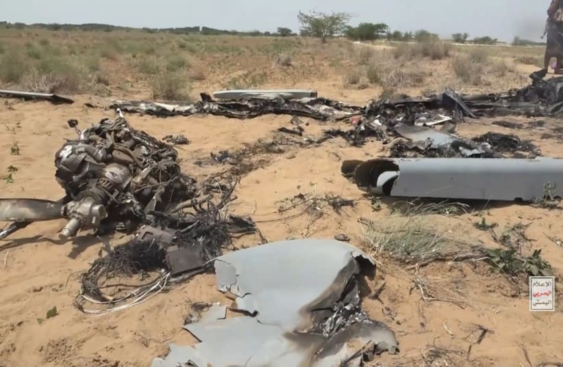 ) In this handout screen grab captured from a video provided by Houthi Media Center, Yemeni Houthi group fighters inspect debris from a Karayel drone of the Saudi-backed forces after it was downed by the Houthi-run air forces during the ongoing fighting in Yemen, September 10, 2026.