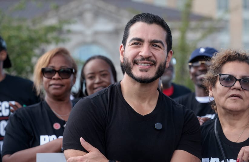 Democratic candidate for US Senate Abdul El-Sayed poses with union members from UAW Local 51 during the Labor Day Parade in Detroit, Michigan, US, September 7, 2026.