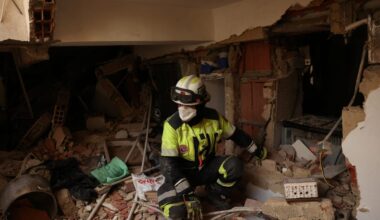 A member of the ECU-11 Guayaquil Fire Department from Ecuador takes part in rescue efforts inside a building that collapsed from the ground floor to the fifth floor, following major earthquakes, in La Guaira, Venezuela, June 29, 2026.