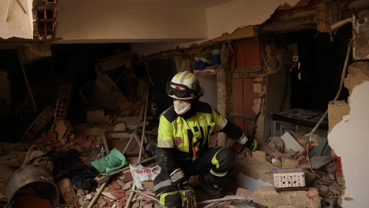 A member of the ECU-11 Guayaquil Fire Department from Ecuador takes part in rescue efforts inside a building that collapsed from the ground floor to the fifth floor, following major earthquakes, in La Guaira, Venezuela, June 29, 2026.