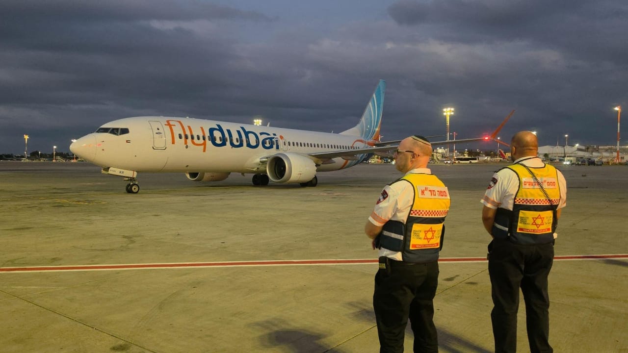 Paramedics examine a 51-year-old male passenger from flydubai flight FZ1073 following his arrival in Israel on a rescue flight after an attempted hijacking, September 30, 2026.