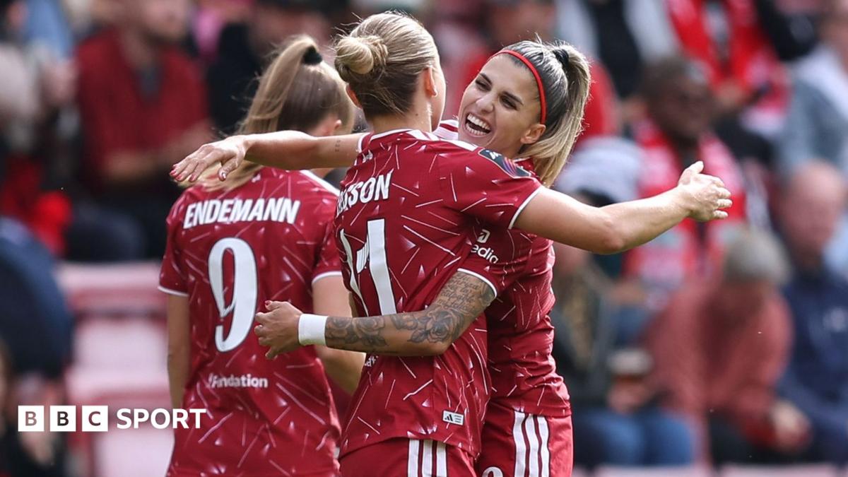 Liverpool's Beata Olsson celebrates scoring against Everton with Natalia Ramos