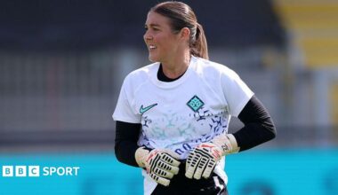 Mary Earps, wearing a white goalkeeper top with black long-sleeved undershirt and black shorts, during a London City Lionesses training session