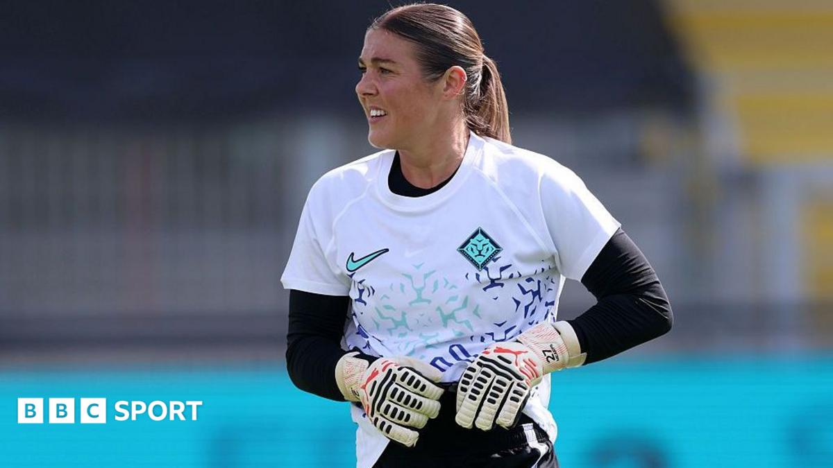 Mary Earps, wearing a white goalkeeper top with black long-sleeved undershirt and black shorts, during a London City Lionesses training session