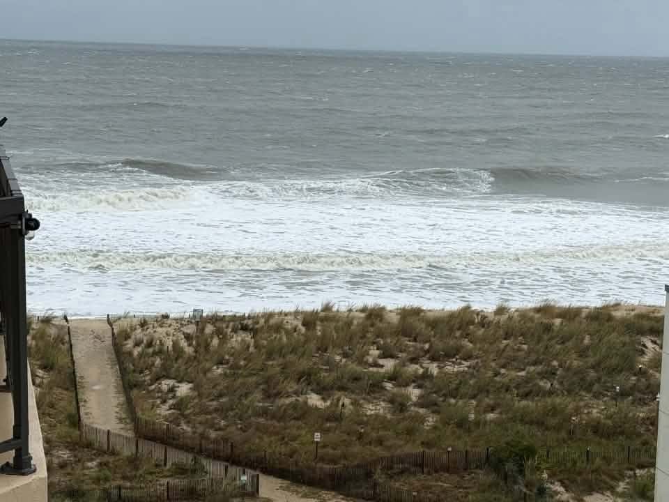 Ocean water running up to the dunes in Ocean City, Maryland on Saturday morning.