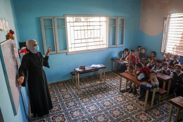 Zahra Saleh works as a kindergarten teacher at the school for a small fee, in exchange for her children’s tuition being waived.
