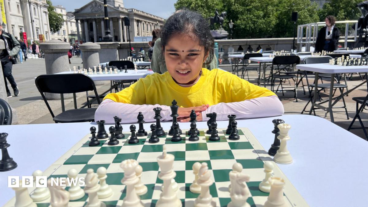 Bodhana Sivanandan poses with a chess board in front of her