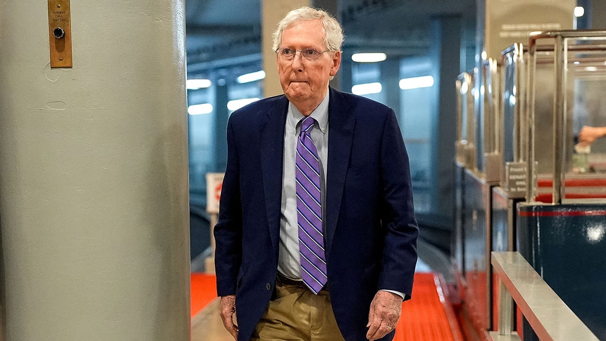 Sen. Mitch McConnell walks in Capitol Hill