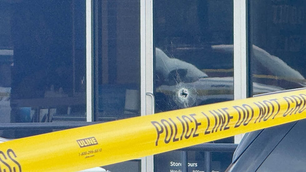 A photo showing what appears to be a bullet hole in the front glass.