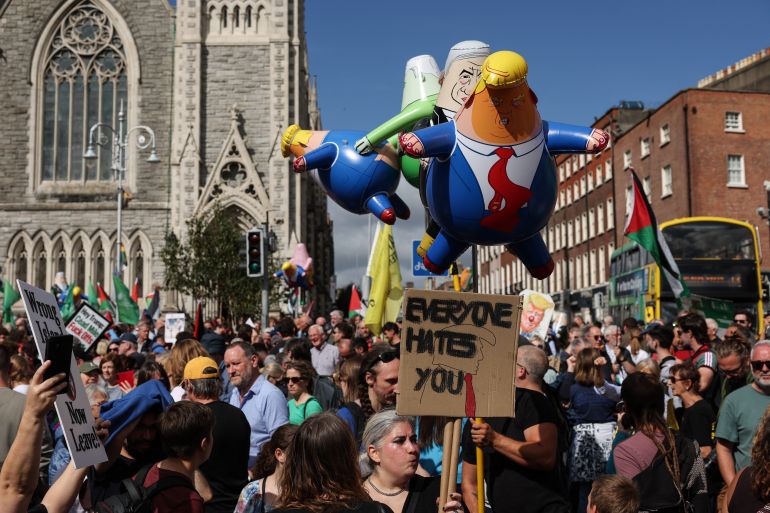 People take part in a protest against the visit of US President Donald Trump in the Irish capital Dublin on September 12, 2026. 