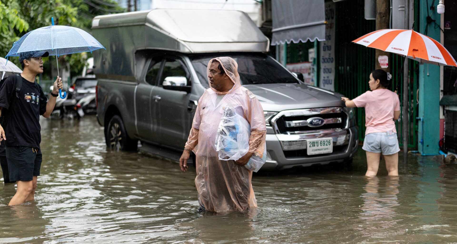 Photos: Heavy rains and flooding in Bangkok force thousands into shelters | Floods News