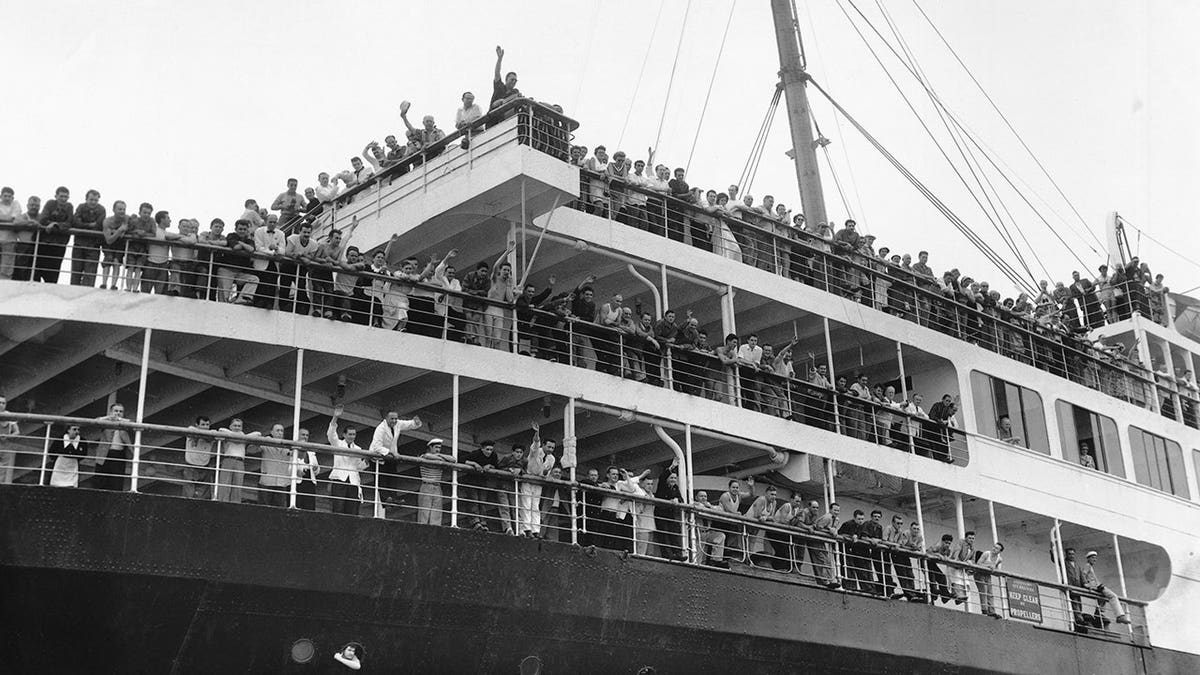 Photo of Andrea Doria survivors being brought to land