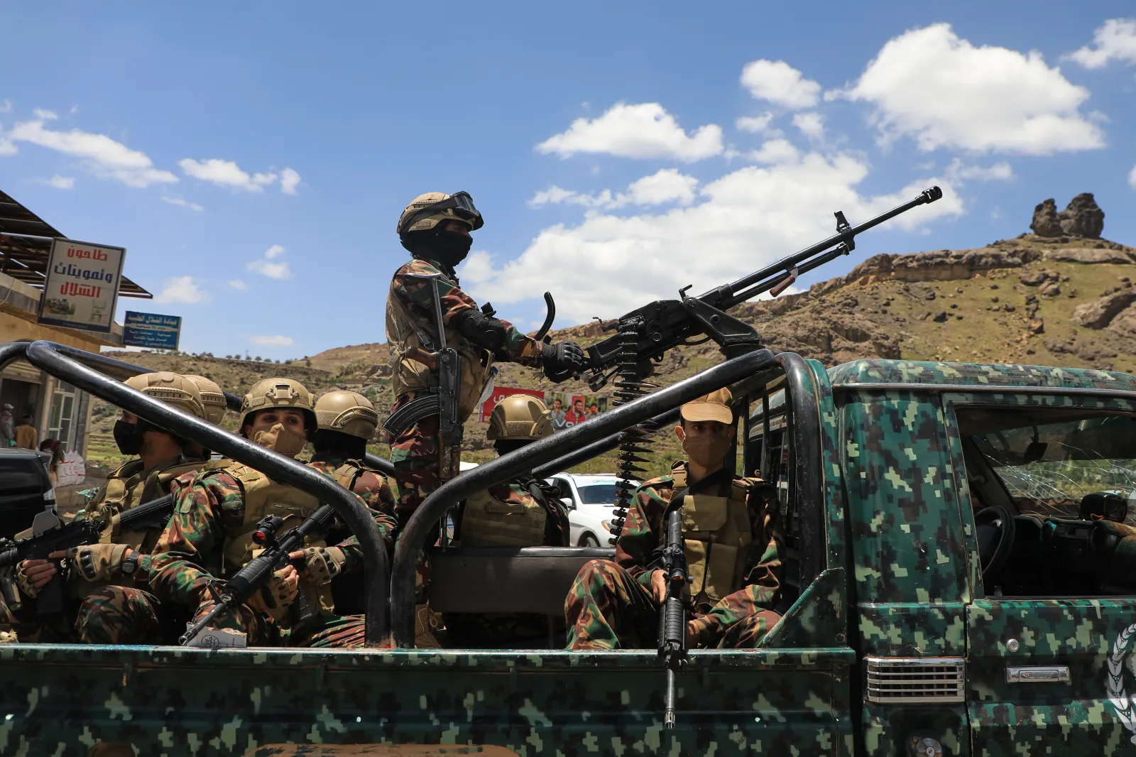 Ansar Allah fighters escort a convoy carrying prisoners freed in Mokha through the Bani Matar district on their way to Sanaa, Yemen, on September 12, 2026, following the takeover of the southern Red Sea port city.
