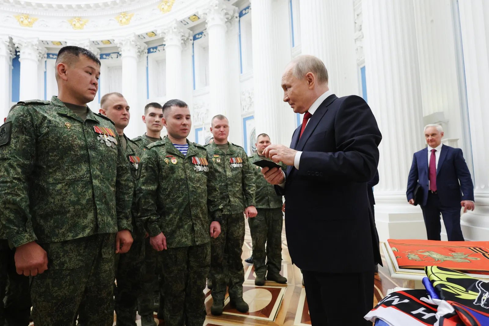 File photo: Russian President Vladimir Putin, foreground right, speaks with members of the military, the Kremlin, Moscow, June 12, 2026.