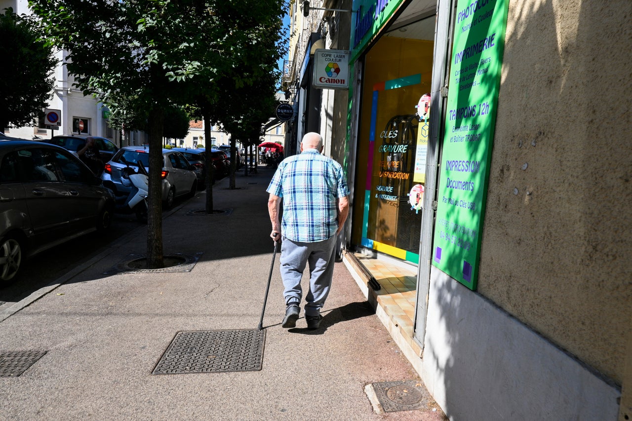 An old man, senior citizen, walking with his walking stick in the heat of a heatwave (Hans Lucas/AFP via Getty Images)