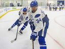 Auston Matthews (front) and Emile Andrae participate at Maple Leafs training camp at the Ford Performance Centre in Toronto, Thursday, Sept. 17, 2026.