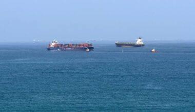 A cargo ship is pictured off coast of the Khor Fakkan Container Terminal, the only natural deep-sea port in the region and one of the major container ports in Sharjah Emirate, along the Gulf of Oman on June 28, 2026. Iran's top diplomat warned on June 28 that any attempt by shipping to bypass its preferred route through the Strait of Hormuz would "increase tensions" in the Middle East, as US and Iranian forces again traded attacks across the vital seaway.