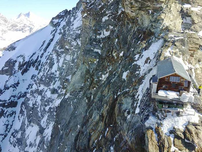 The hut on a shoulder of the steep, snow and ice plasterred rock face of Cervino.