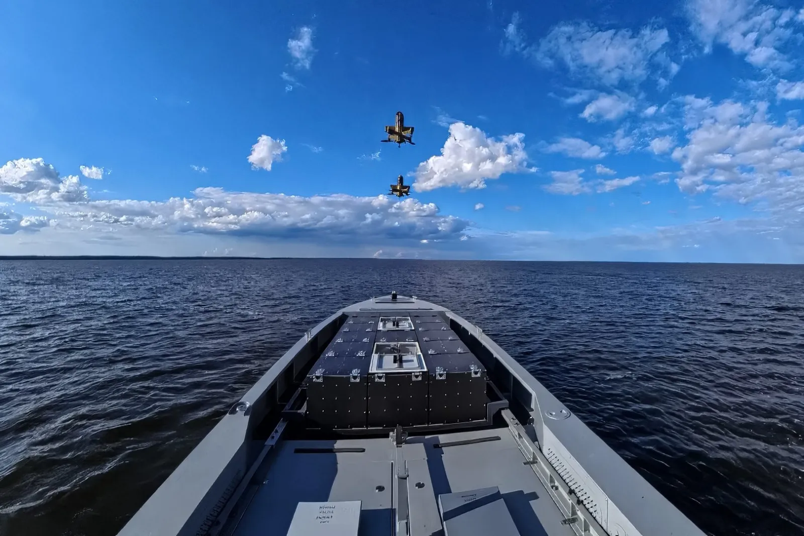 Aerial drones are seen deploying from the bay of a MAGURA maritime drone developed by UFORCE.