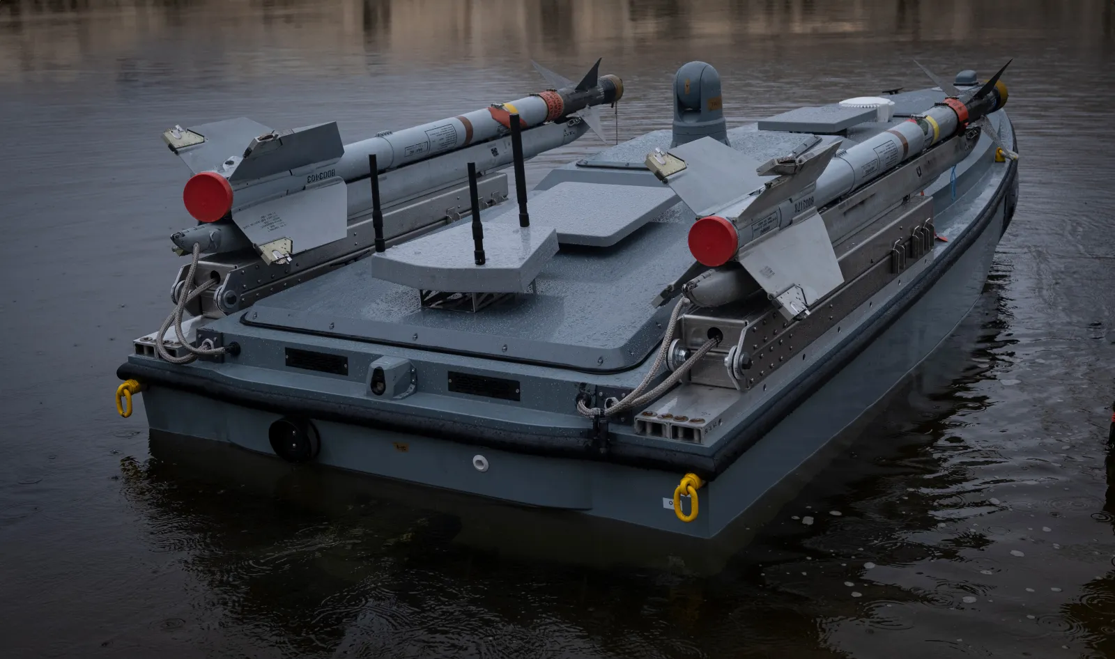A variant of UFORCE's MAGURA marine drone is pictured carrying a pair of missiles.