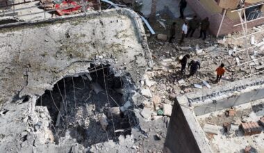 People inspect damage and debris at a building that Iranian media said was hit by a US strike while a wedding celebration was taking place there, in Kuhestak, southern Iran, on Sept. 2, 2026.