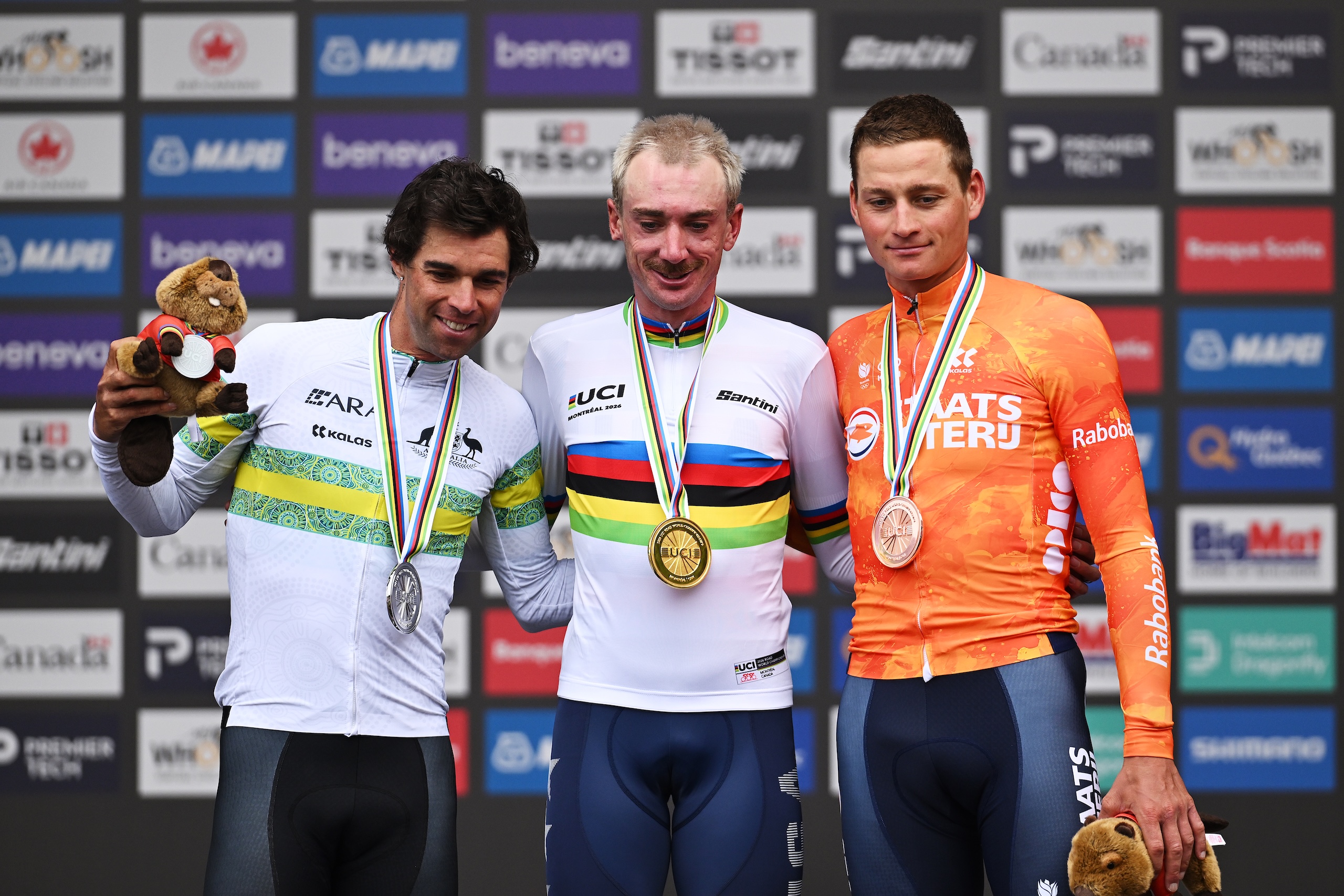 MONTREAL, QUEBEC - SEPTEMBER 27: (L-R) Silver medalist Michael Matthews and Team Australia, gold medalist Brandon McNulty and Team United States and bronze medalist Mathieu Van Der Poel and Team Netherlands pose on the podium during the medal ceremony after the 99th UCI Road World Championships Montreal 2026 - Men Elite Road Race a 273.4km one day race from Brossard to Montreal on September 27, 2026 in Montreal, Quebec. (Photo by Dario Belingheri/Getty Images)