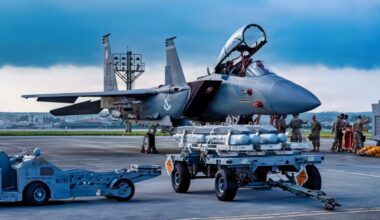 U.S. Air Force Airmen assigned to the 67th Fighter Generation Squadron prepare to load munitions onto a U.S. Air Force F-15EX Eagle II assigned to the 85th Test and Evaluation Squadron, Eglin Air Force Base, Florida, at Kadena Air Base, Japan, July 8, 2026. Airmen from the 67th Fighter Generation Squadron trained alongside the 85th TES gaining hands-on experience loading munitions on the F-15EX Eagle II and F-15E Strike Eagle while supporting test and evaluation operations. (U.S. Air Force photo by Airman 1st Class Gracelyn Hess)