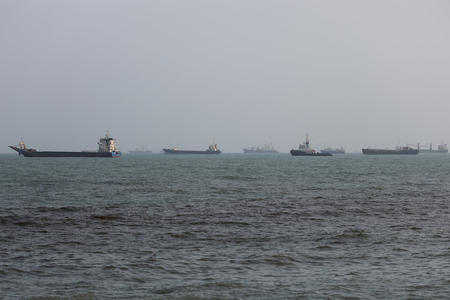 Ships are anchored in the Strait of Hormuz on Aug. 10, 2026 off the coast of Bandar Abbas, Iran. In a recent statement, Iran's Supreme National Security Council said the vital waterway would not reopen until the United States corrects its behavior, demanding that the US end its war on Iran and compensate the country for war damage, among other conditions. Iran has largely halted vessel traffic through the strait with the threat of strikes; meanwhile, the US has imposed a blockade on Iranian ports.