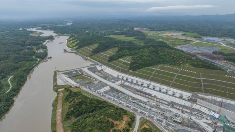 QINZHOU, CHINA - AUGUST 16 2025: Aerial view of the Qingnian Ship Lock of the 135-kilometer Pinglu Canal under construction in Qinzhou, south China's Guangxi Zhuang Autonomous Region, Saturday, Aug. 16, 2025. Designed to accommodate 5,000-ton-class vessels through three ship locks, the massive project will link the Xi River with the Beibu Gulf to create a new inlandsea waterway and reduce cargo transport costs. (Photo credit should read PENG HUAN / Feature China/Future Publishing via Getty Images)