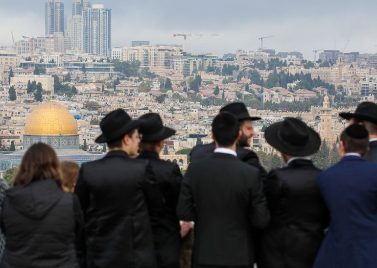 Hundreds of Jewish settlers worship atop buildings in Jerusalem's Old City overlooking the Western Wall on the third day of the Sukkot, a Torah-commanded Jewish holiday, in Jerusalem on October 09, 2025. [Gazi Samad/Anadolu via Getty Images]
