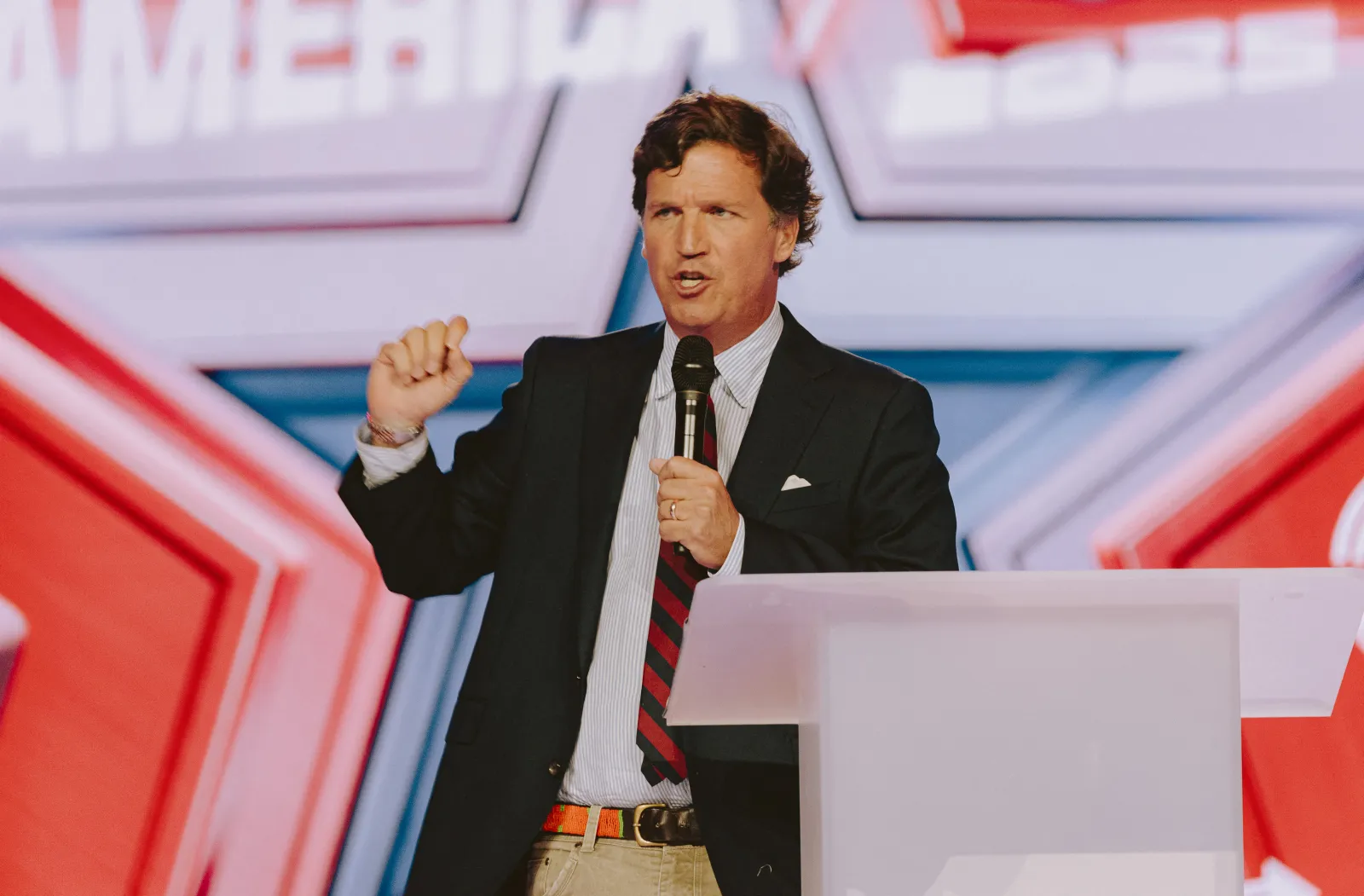 Conservative political commentator and podcast host Tucker Carlson speaks at Turning Point's annual AmericaFest conference, in remembrance of late right-wing political activist Charlie Kirk, in Phoenix, Arizona on December 18, 2025. (Photo by Olivier Touron / AFP via Getty Images)