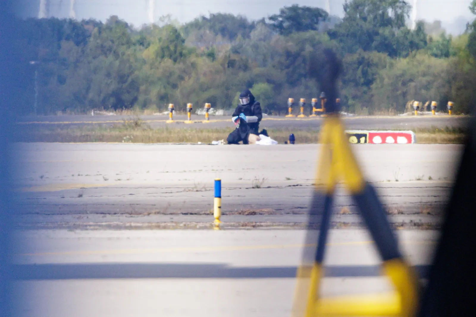 A German police investigator works following the detection of a drone allegedly armed with explosives near a Ukrainian Antonov cargo plane at Leipzig/Halle Airport on August 5, 2026, near Leipzig, Germany.