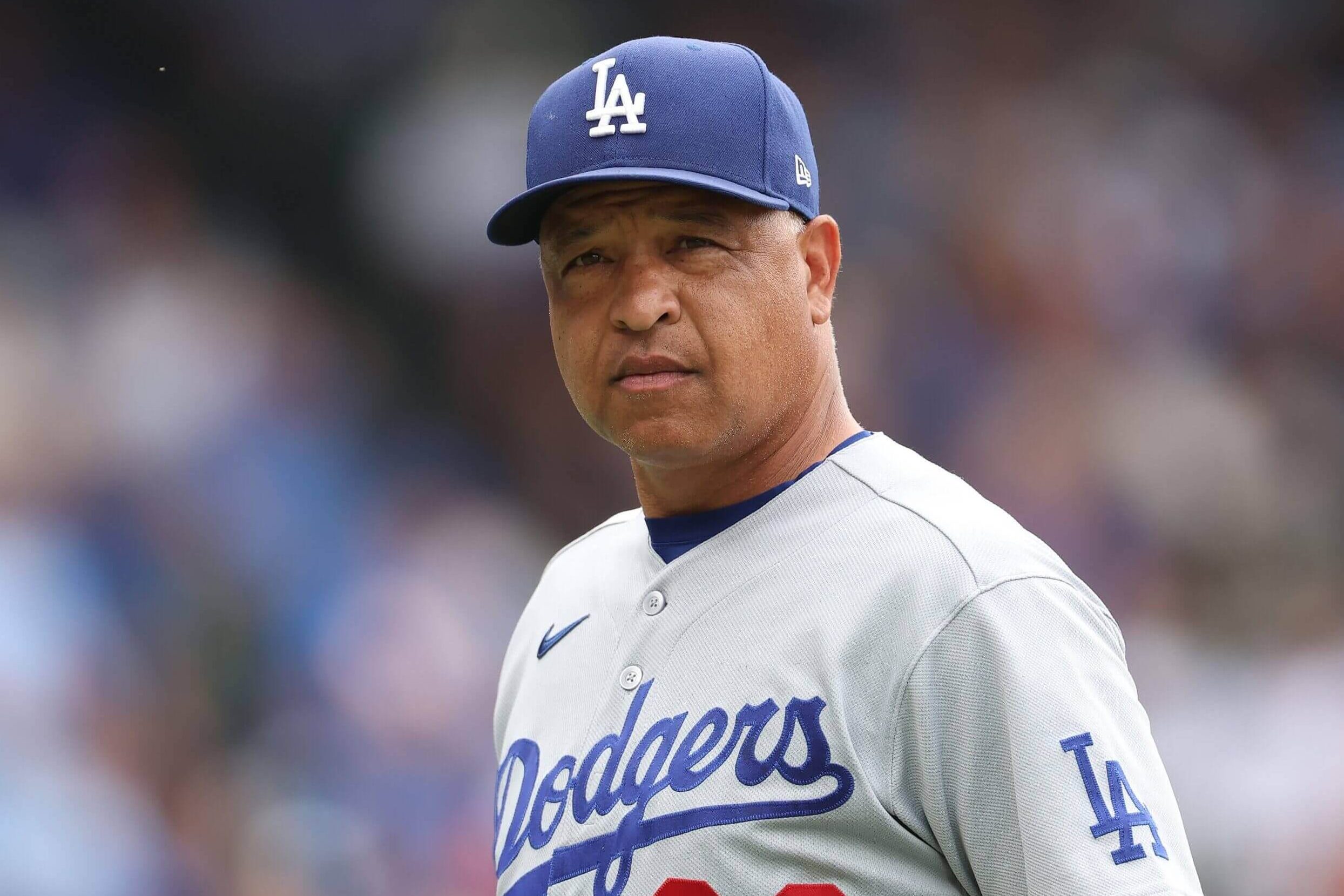 Dave Roberts looks on.