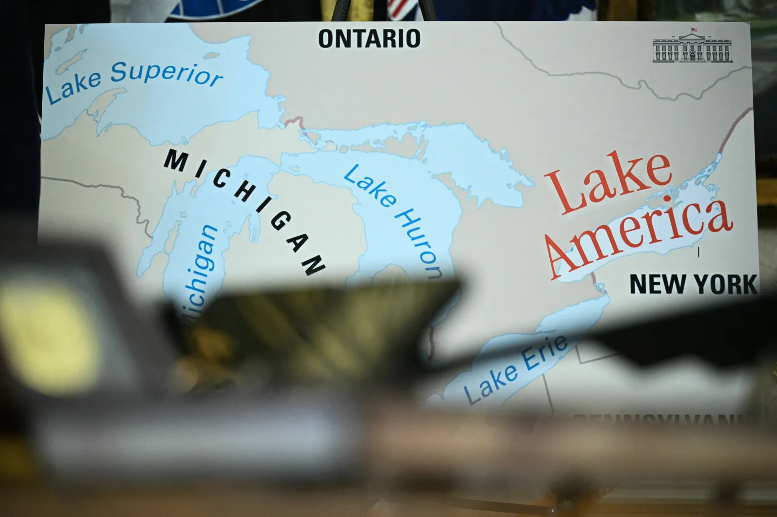 A map is displayed as US President Donald Trump signs an executive order that aims to rename Lake Ontario to Lake America in the Oval Office on August 27, 2026. (Photo by Jim WATSON / AFP via Getty Images)