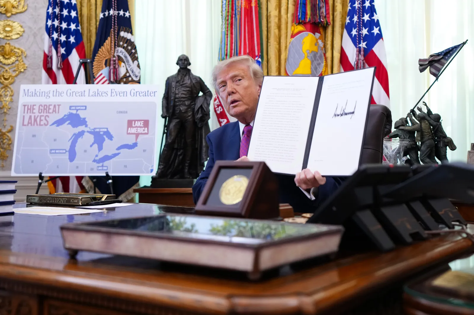 File photo: Trump displays a signed executive order at an event in the Oval Office, the White House, Washington, D.C., August 27, 2026