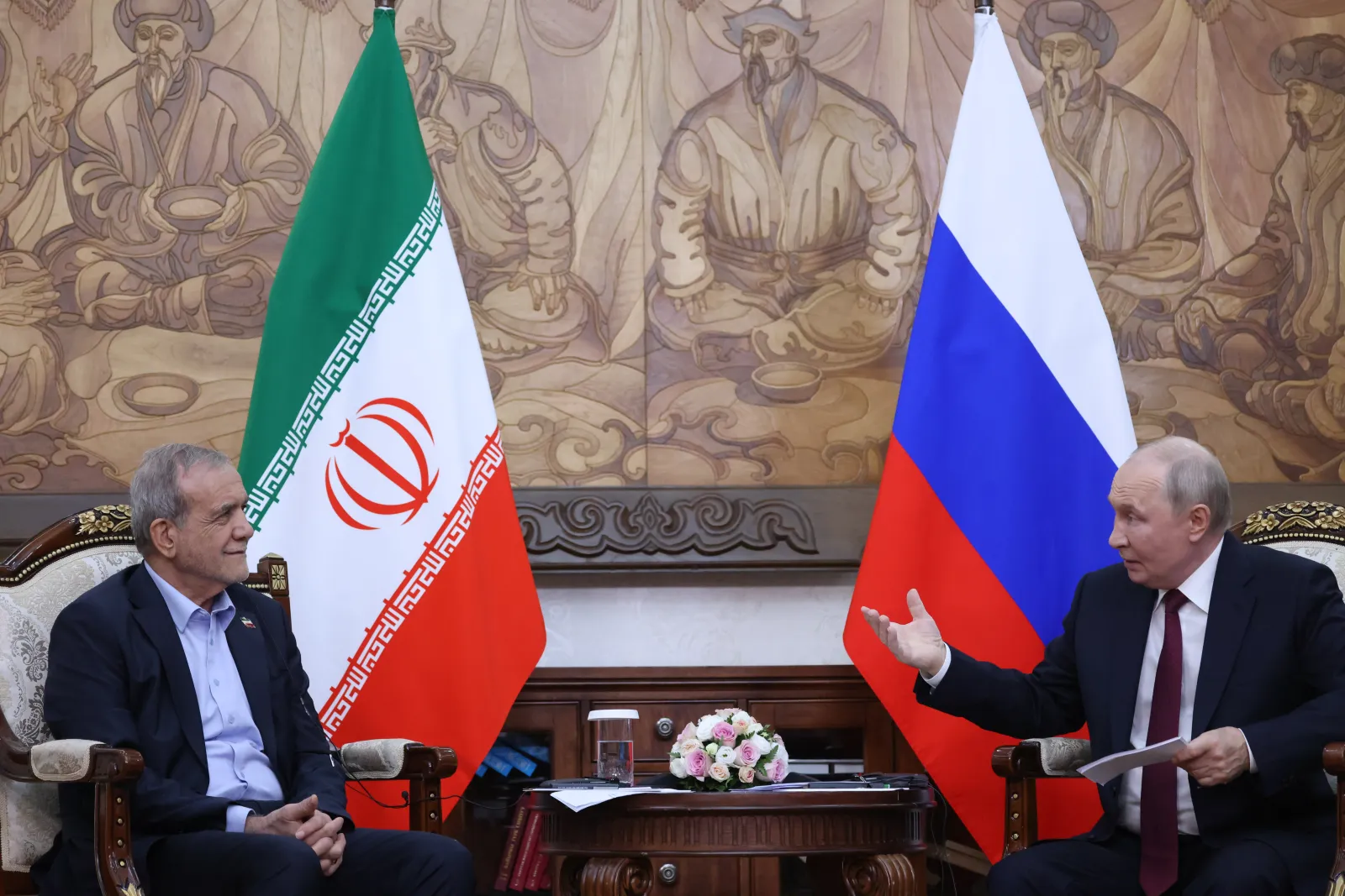 Russian President Vladimir Putin, right, talks to Iranian President Masoud Pezeshkian on the sidelines of the Shanghai Cooperation Organization on September 1, 2026, in Bishkek, Kyrgyzstan.