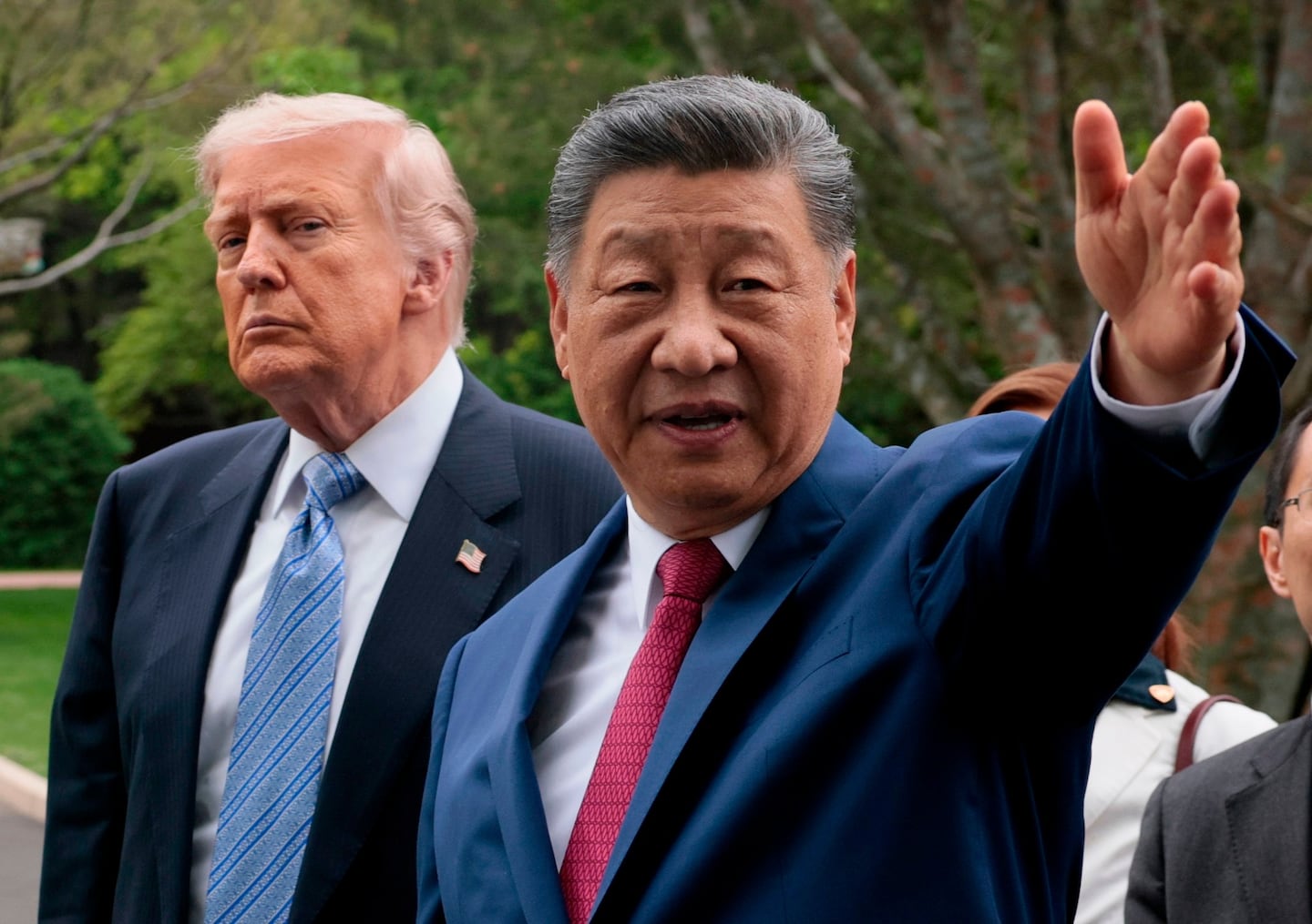 Chinese President Xi Jinping, right, gestures as he greets President Trump at Zhongnanhai Garden in Beijing, China, on May 15.