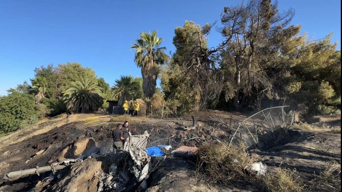 The aftermath of a plane crash at 7300 block of N. Blythe Avenue. Two children were killed and two others were seriously injured.