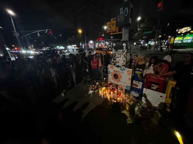 Friends gather to mourn victim Daria Serkov at the site of the crash on 14th St. and 1st Ave. in Manhattan on Saturday. (Julian Roberts-Grmela / New York Daily News)