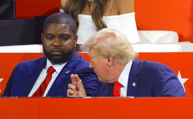 President Donald Trump and Rep. Byron Donalds (FL) sit together during Day 1 of the Republican National Convention (RNC), at the Fiserv Forum in Milwaukee, Wisconsin, U.S., July 15, 2024.