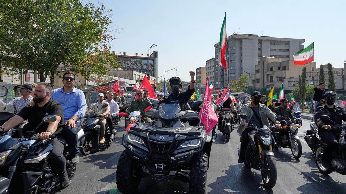 Motorcyclists ride during a state-organized motorcycle parade
