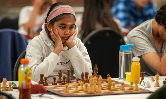 LIVERPOOL, ENGLAND - AUGUST 07: Bodhana Sivanandan, a nine-year-old chess prodigy, competes in the British Chess Championships at St. George's Hall on August 07, 2025 in Liverpool, England. The 111th British Chess Championships are taking place in Liverpool between 31 July to 10 August, with competitors vying for the title in the women's, men's, juniors' and over-60 groups. Organized by the??English Chess Federation, the competition has been run annually - apart from war years - since 1904. (Photo by Christopher Furlong/Getty Images)