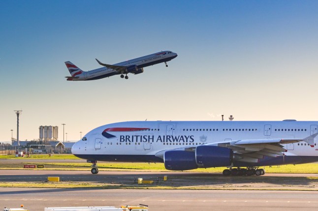 British Airways Airbus A380 with another of the airline's planes taking off in the background
