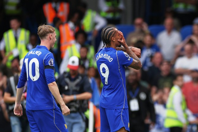 Chelsea's Joao Pedro, right, celebrates after scoring his side's third goal during the English Premier League soccer match between Chelsea and Brighton and Hove Albion in London, Sunday, Aug. 30, 2026. (AP Photo/Ian Walton)